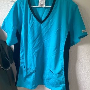 Size 3x Scrub top and pants.  Cherokee scrub pants 95% polyester, 5% spandex.